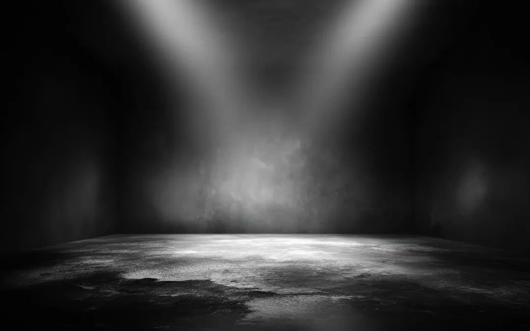 An empty stage lit by spotlights